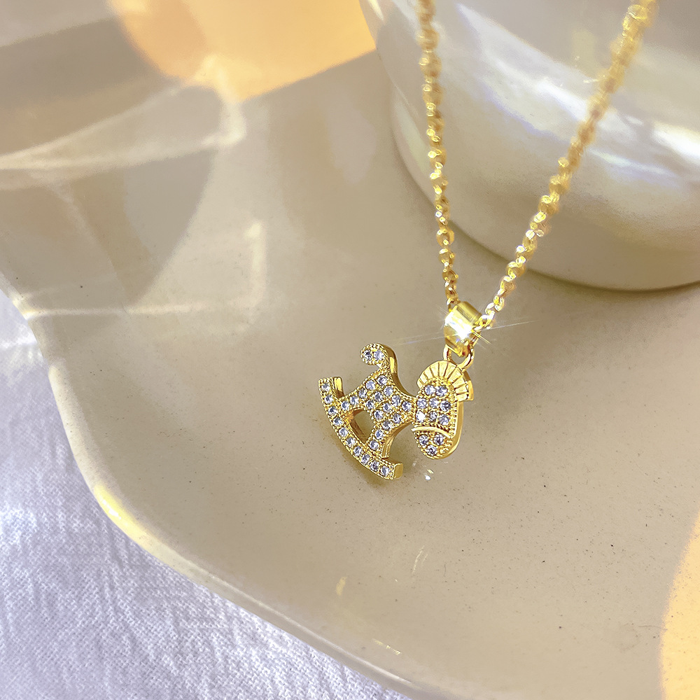 Cute design sense rocking rocking horse necklace, women's fashion, versatile, exquisite zircon collarbone chain, titanium steel jewelry wholesale Application Scenario
