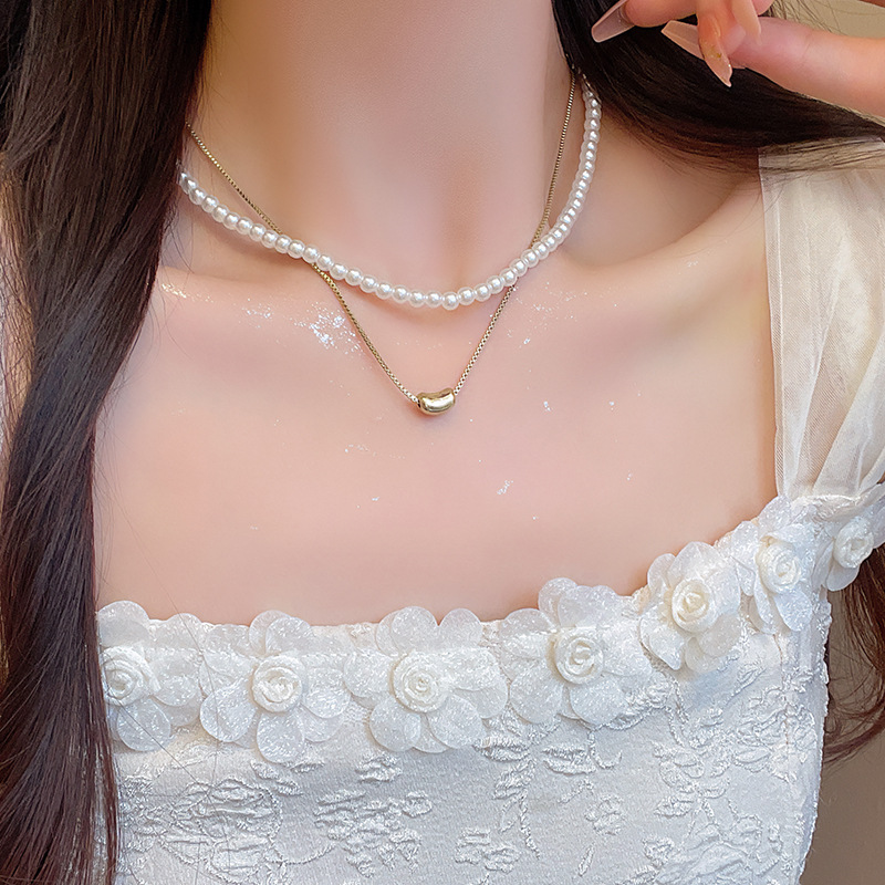 This Korean-style double-layered love bean imitation pearl necklace exudes a feminine and high-end charm and is versatile. The collarbone chain is a trendy accessory for a stylish look details Picture