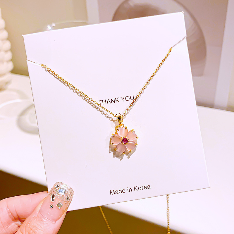 Wholesale of simple pink cherry blossom pendant titanium steel necklace with a unique design sense for women, cat's eye stone flower collarbone chain details Picture