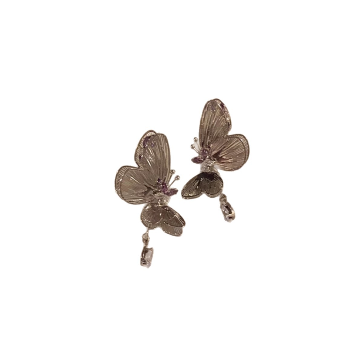 The ethereal purple zirconia dynamic hollowed-out butterfly unique earrings exude a light luxury and high-end feel for women. The niche stud earrings are exquisite Item Picture