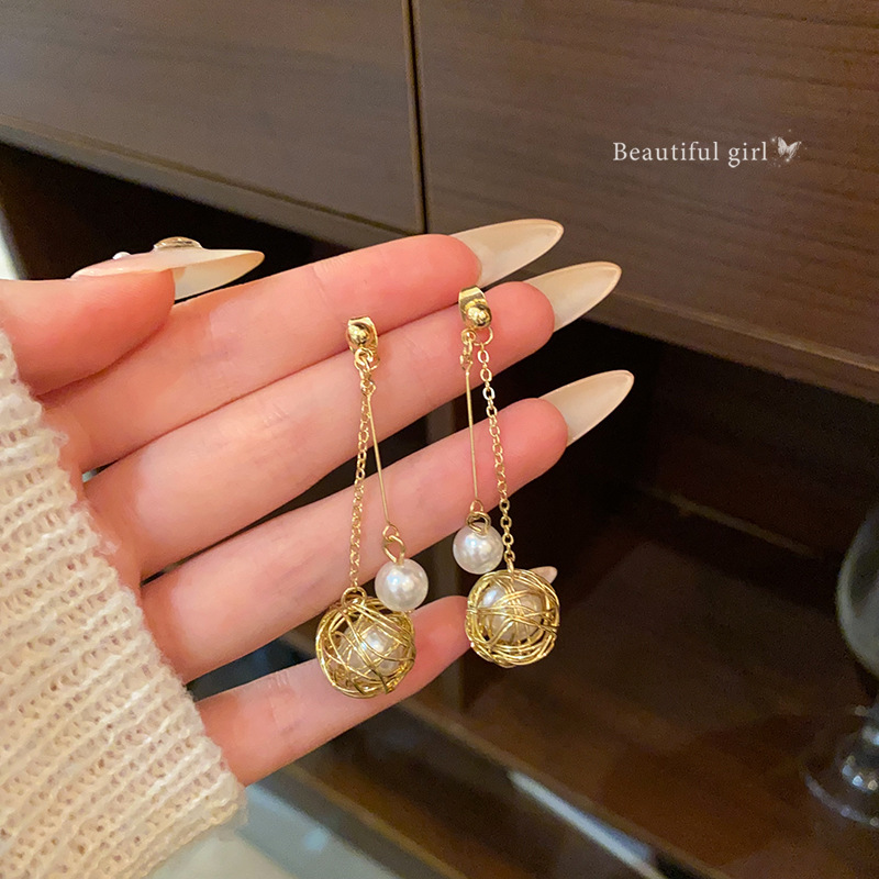 European and American hollowed-out wrapped pearl tassel earrings, women's light luxury style, versatile and high-end long earrings, popular earrings full figure