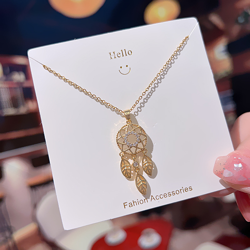 Korean style cat's eye dreamcatcher titanium steel necklace for women, simple and versatile, tassel zircon exquisite design collarbone chain full figure