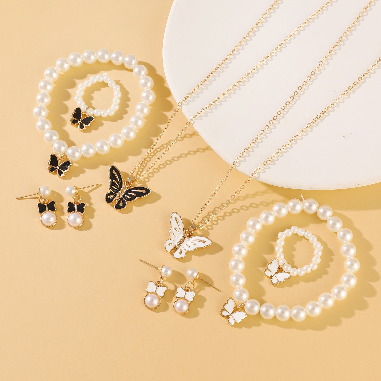 European and American versatile and personalized oil-dripping butterfly stud ring, bracelet, necklace four-piece set, fashionable pearl set jewelry for women Specification drawing