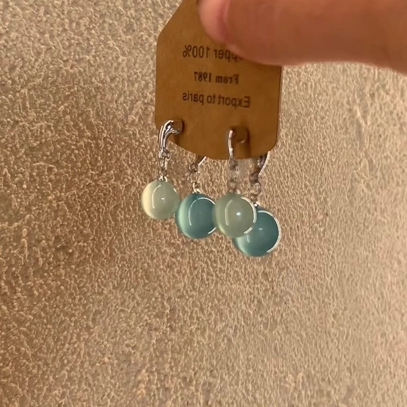 Cool summer ~ Ice-transparent round ball cross earrings, a unique 2025 new high-end and niche earring accessory for women Application Scenario