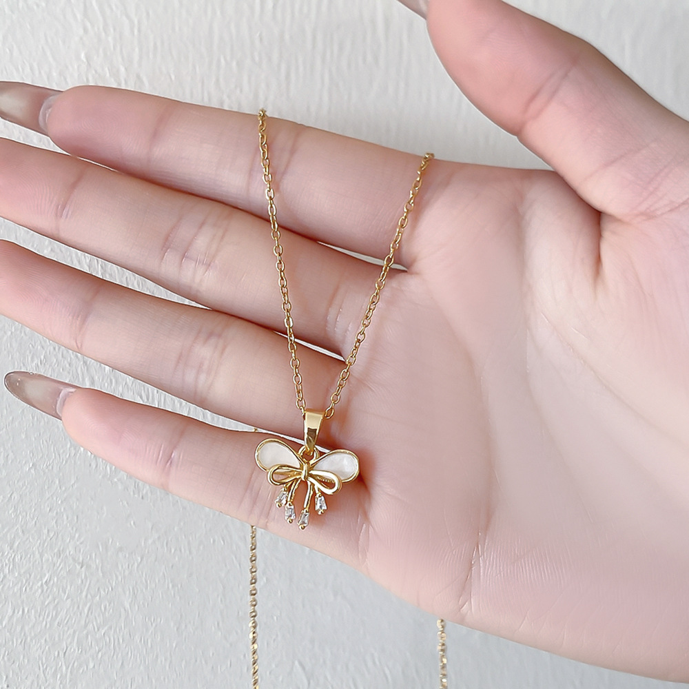 Real gold electroplated bow pendant, titanium steel necklace, women's niche light luxury diamond-encrusted collarbone chain, internet-famous high-end accessory details Picture
