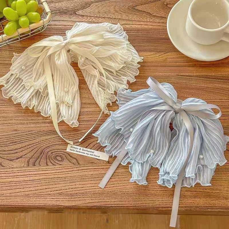 A super beautiful ice blue high-end pleated bow ponytail clip with a fairy-like, elegant and laid-back vacation style grab clip headwear full figure