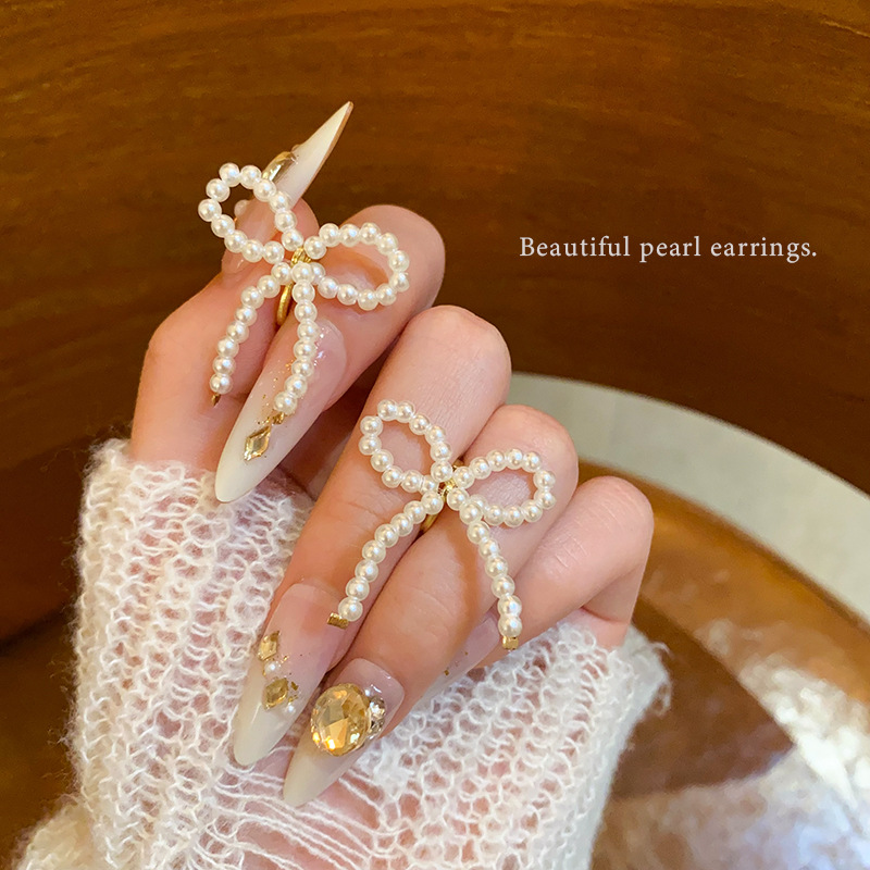 French sweet pearl bow ear buckles, high-end elegance, versatile earrings, niche design sense, new earrings for women full figure