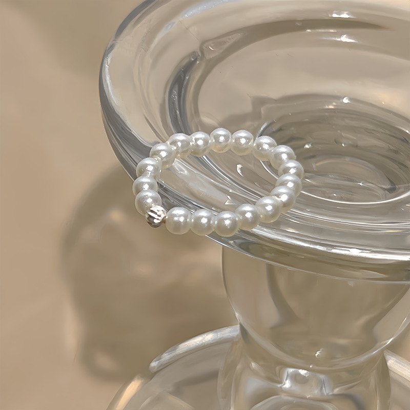 A bow-shaped pearl-like elastic ring for women, exuding a light luxury and high-end charm. A layered index finger ring with a cold style, a ring trend Specification drawing