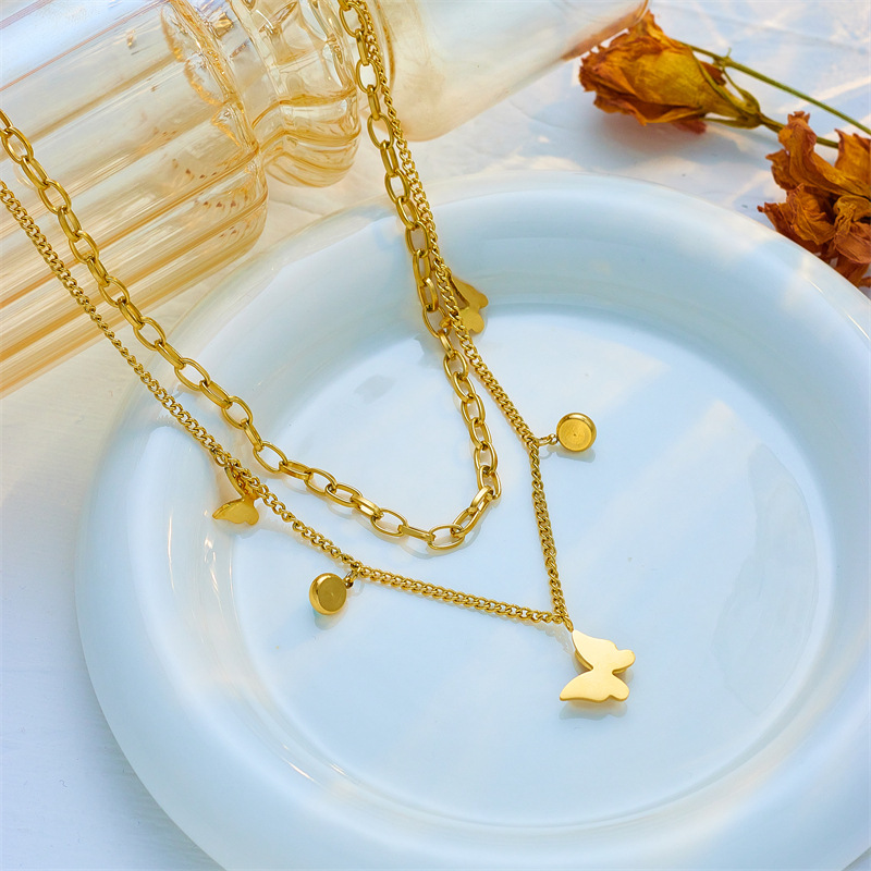 A cross-border fashion and niche double-layer overlapping blue turquoise pendant three-dimensional butterfly titanium steel jewelry necklace from Europe and America details Picture