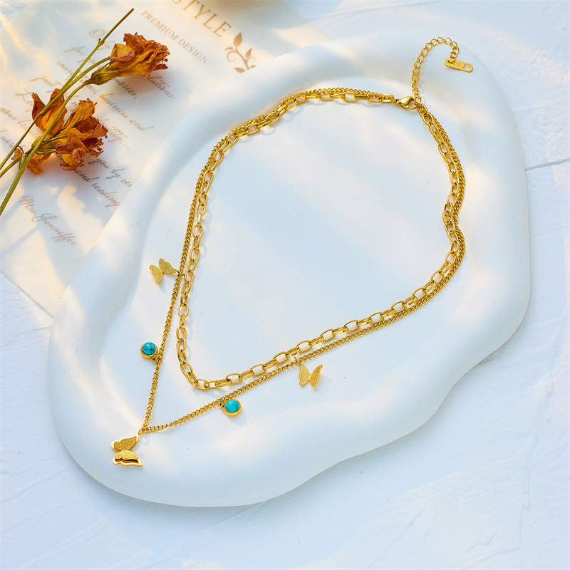 A cross-border fashion and niche double-layer overlapping blue turquoise pendant three-dimensional butterfly titanium steel jewelry necklace from Europe and America Specification drawing