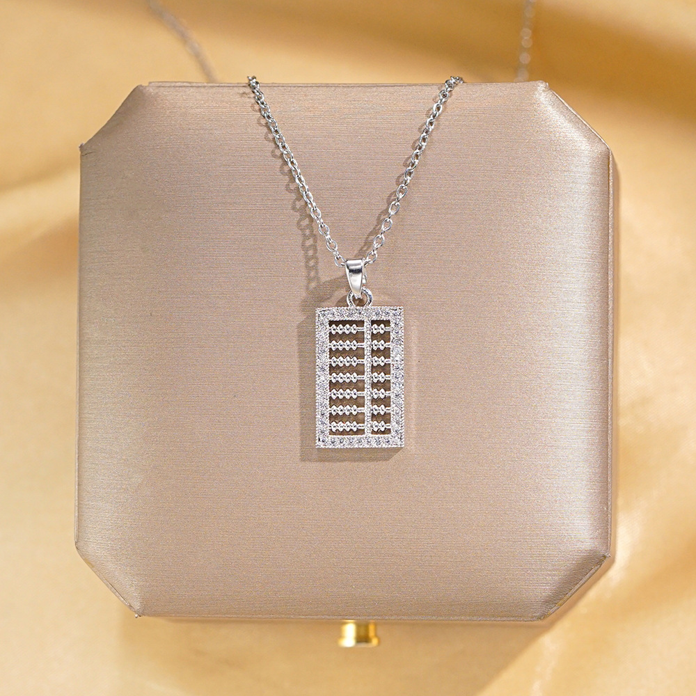 A light luxury Japanese and Korean pendant with a small abacus and titanium steel necklace, a fashionable collarbone chain by a female Internet celebrity, and a niche high-end accessory full figure