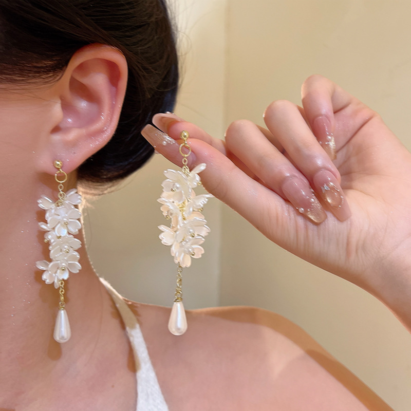 High-end white pearl tassel petal earrings, European and American fashion, versatile, exaggerated and elegant, long stud earrings for women details Picture