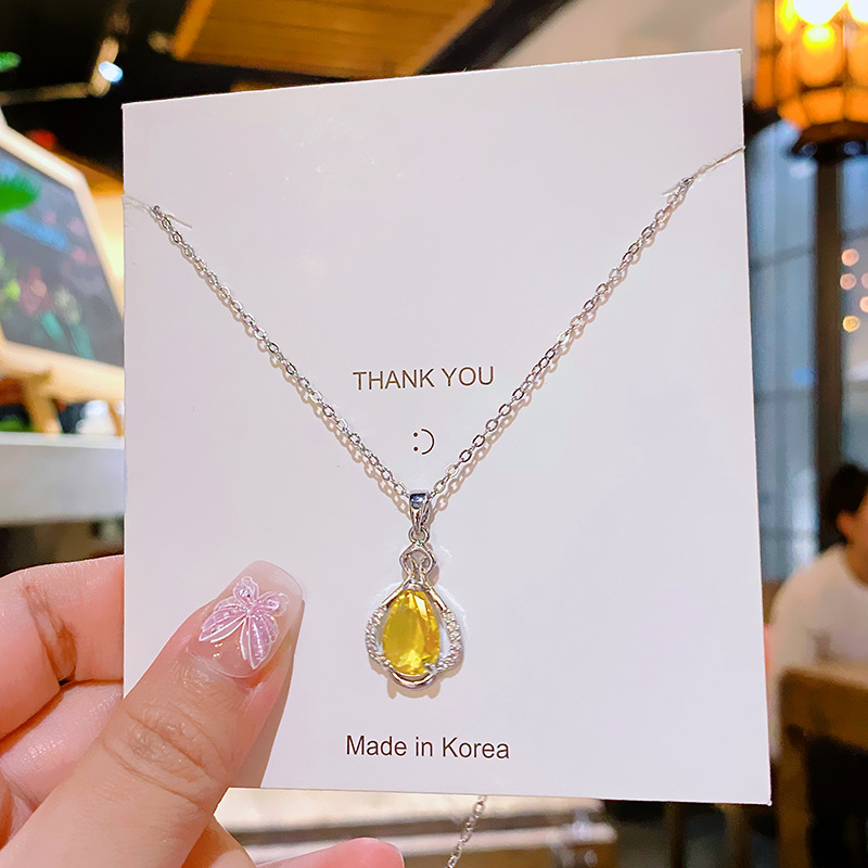 Yellow water drop zircon perfume bottle pendant, titanium steel necklace, women's niche design sense, versatile collarbone chain, elegant accessory details Picture