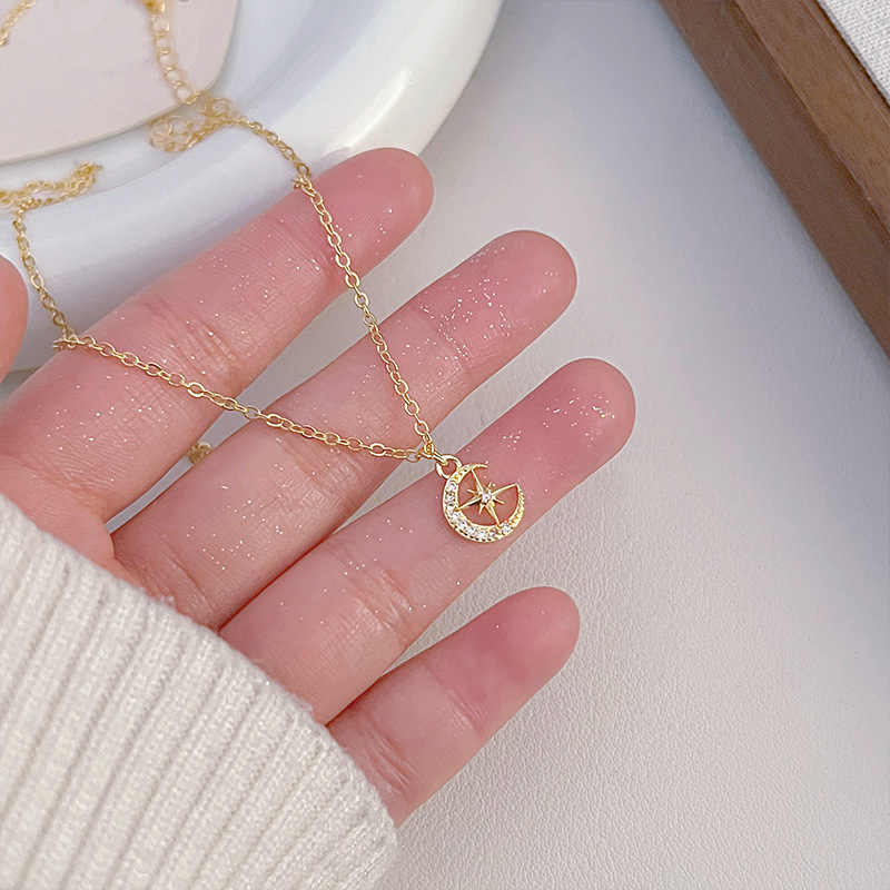 This is a unique and exquisite golden pendant necklace, a sweet star and moon zircon geometric new design with a sense of style and elegance Specification drawing
