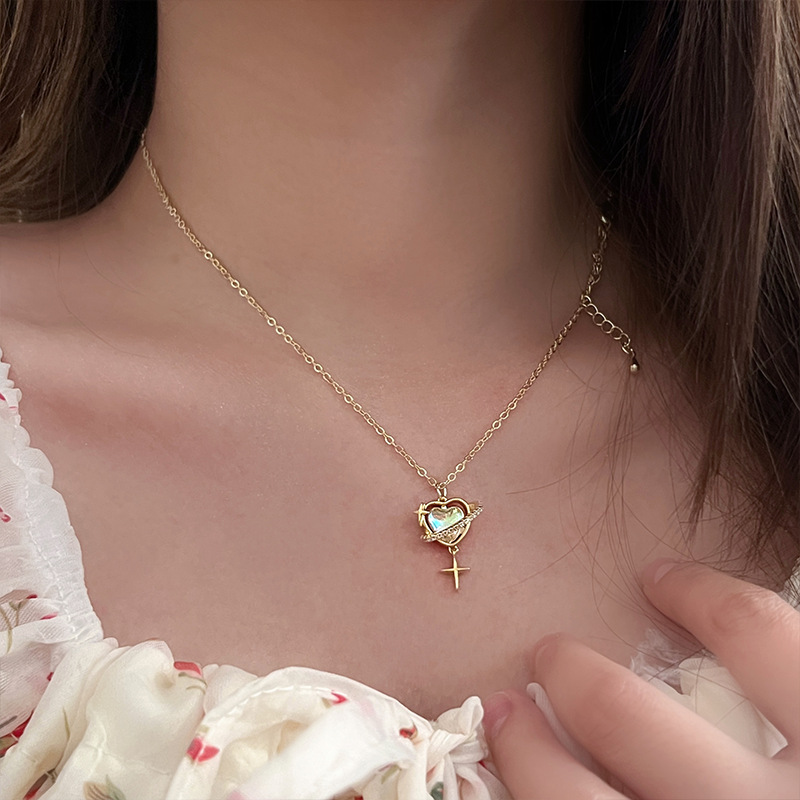 The new 2024 fashion Planet necklace for women features a light luxury and niche design with tassels, a simple and versatile sweater and collarbone chain full figure