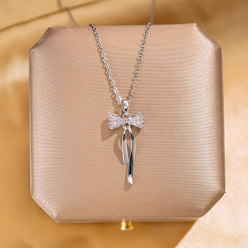 Fashionable and elegant, light luxury, full diamond bow tassel necklace for women, unique and versatile, high-end collarbone chain, silver accessory full figure