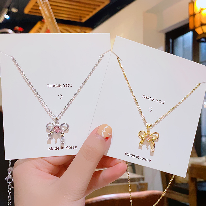 A light and luxurious pink bow titanium steel necklace, a fashionable and niche design for women, a popular collarbone accessory with a high-end feel full figure