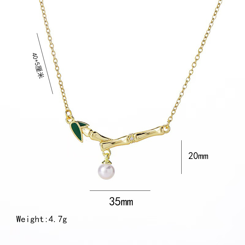This is a genuine gold electroplated small bamboo joint titanium steel necklace with a fashionable and light luxury design. It features a pearl pendant and a collarbone chain, making it a versatile accessory Item Picture