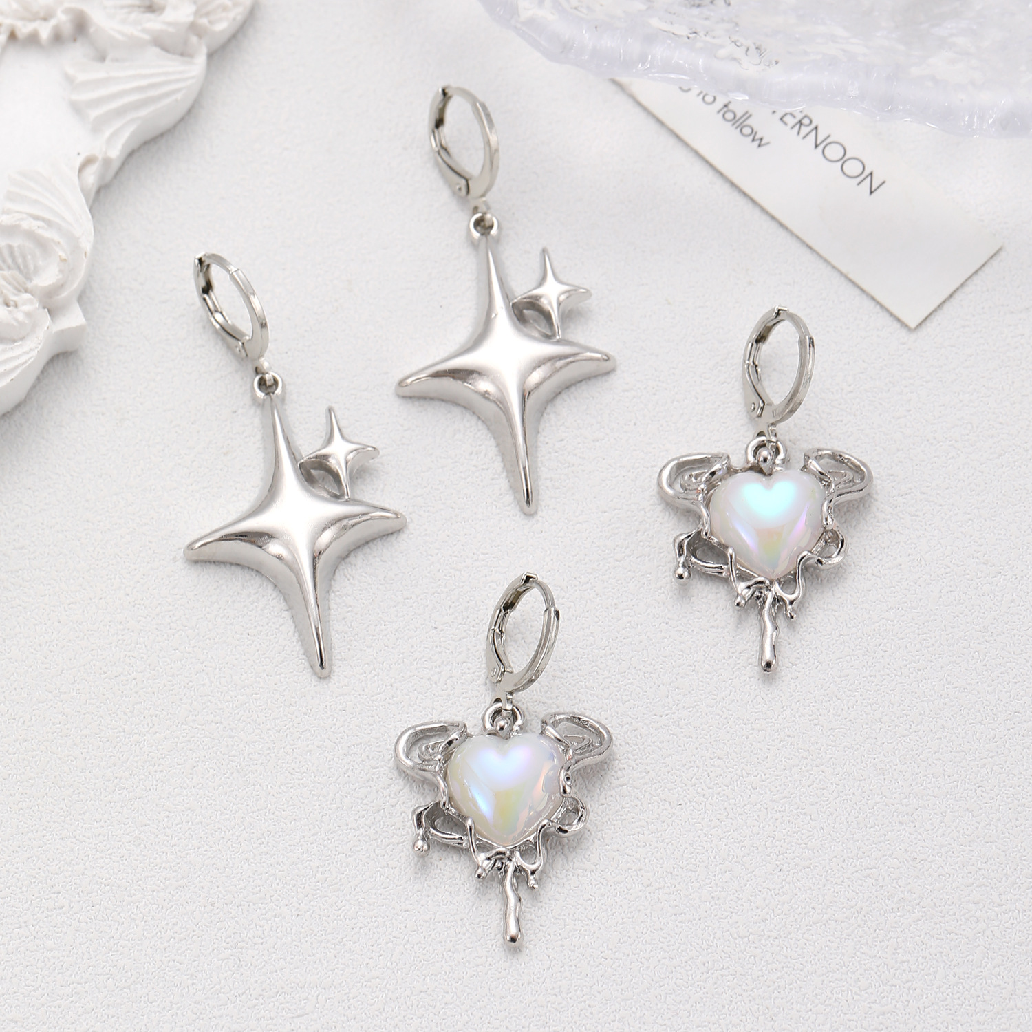 European and American cross-border heart-shaped star four-pointed star earrings, high-end, simple and light luxury autumn and winter earrings for women wholesale Application Scenario
