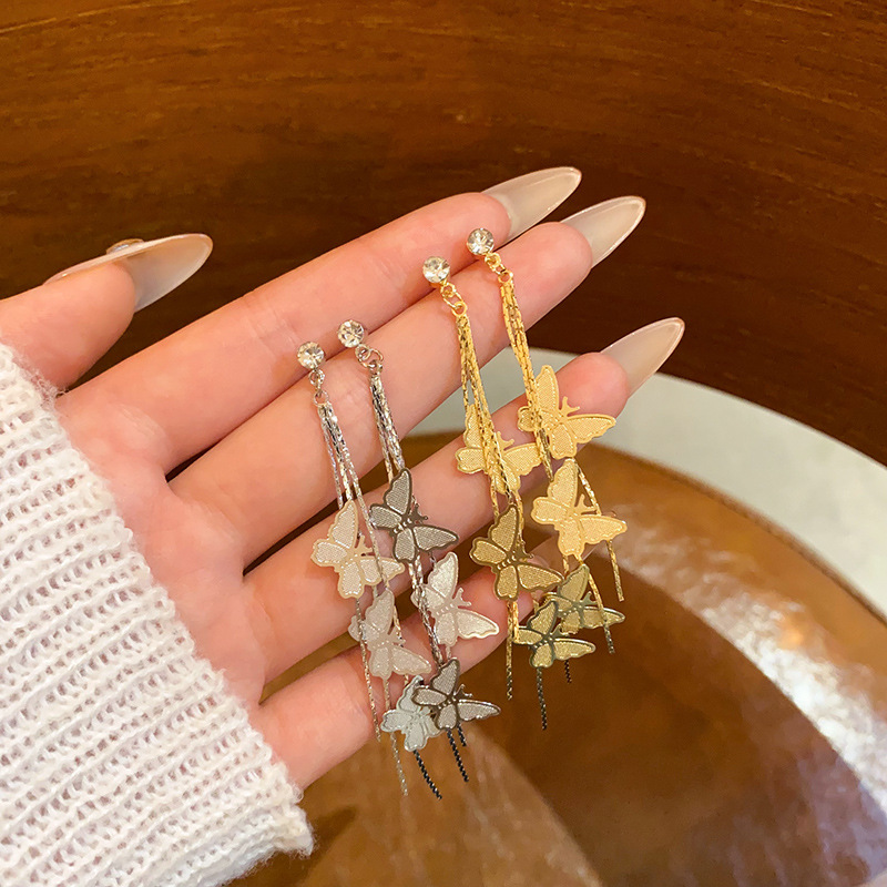 The super ethereal butterfly tassel stud earrings are fashionable and elegant for women, with a light luxury and high-end feel. The long zirconia earrings are slightly inlaid full figure