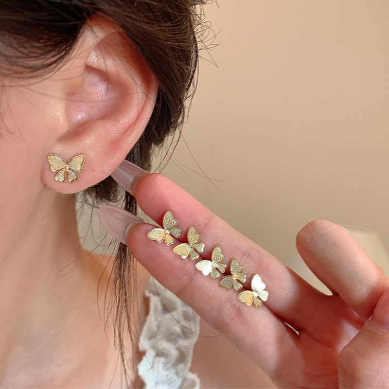 European and American ins style golden butterfly stud earrings for women, a light luxury, niche and high-end three-piece set of earrings, a best-selling ear accessory details Picture