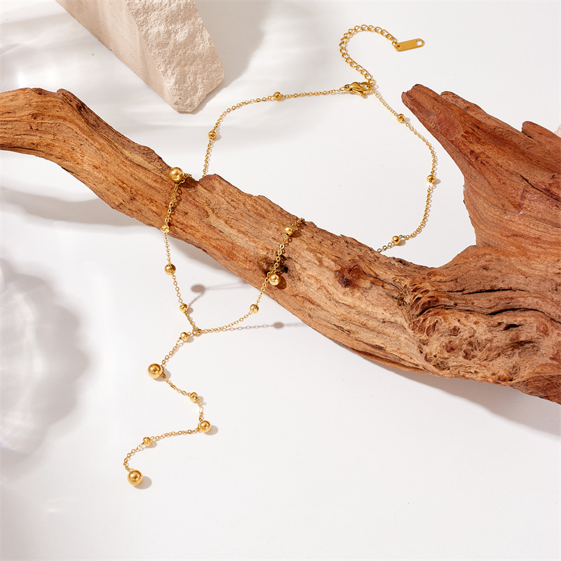 Fashionable and simple, versatile for commuting, long tassel round ball, gold bead pendant, chain, titanium steel jewelry necklace details Picture