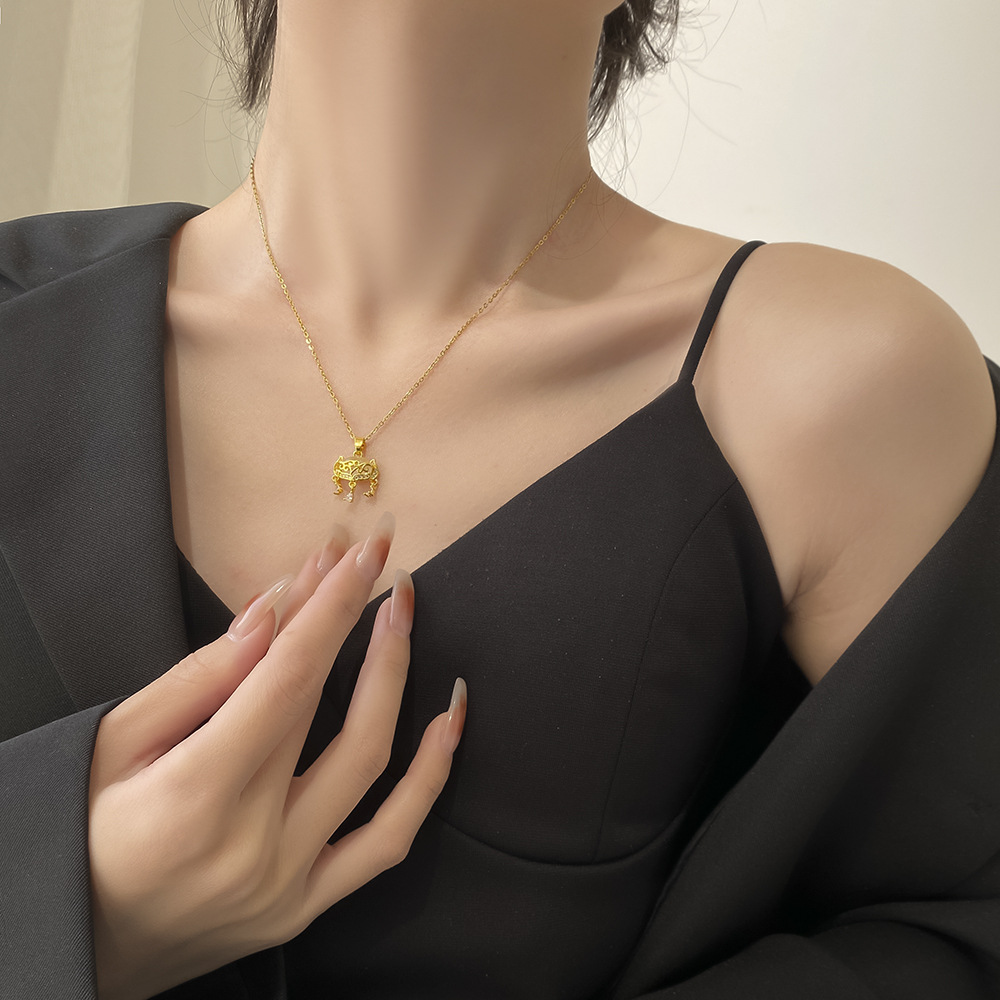 A high-end Japanese and Korean cat's eye stone fox-shaped safety lock pendant titanium steel necklace, a women's niche and light luxury tassel accessory Application Scenario