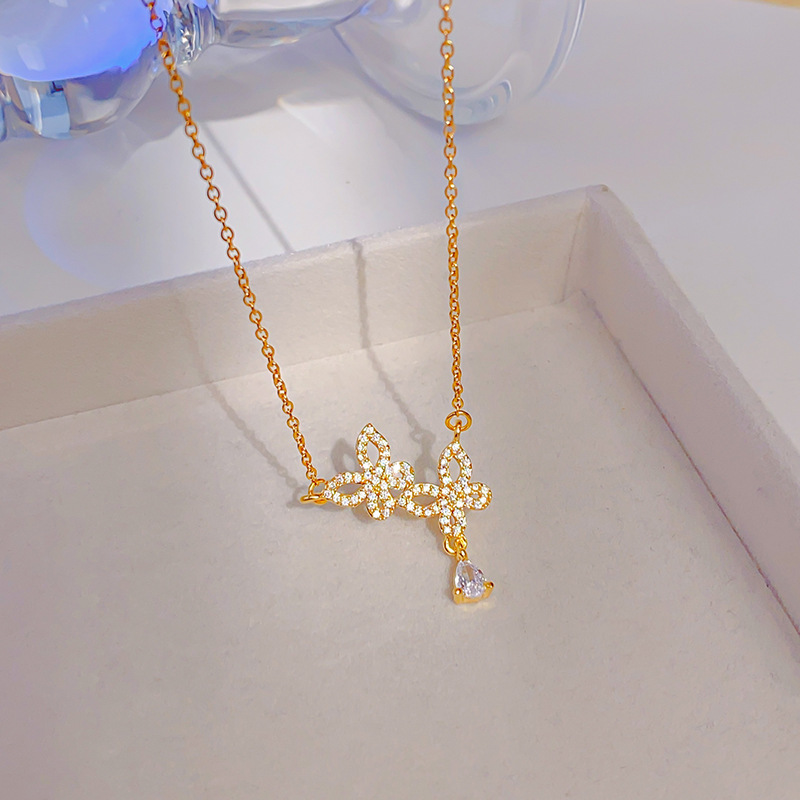 Korean style double butterfly titanium steel necklace for women, zircon water drop tassel pendant, fashionable and light luxury accessory wholesale details Picture