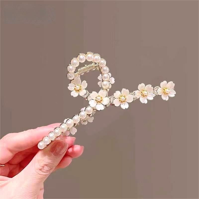 Korean camellia flower hairpin at the back of the head exudes a feminine charm. Shark hairpin with a high-end feel. Hair clip headwear for a female summer details Picture