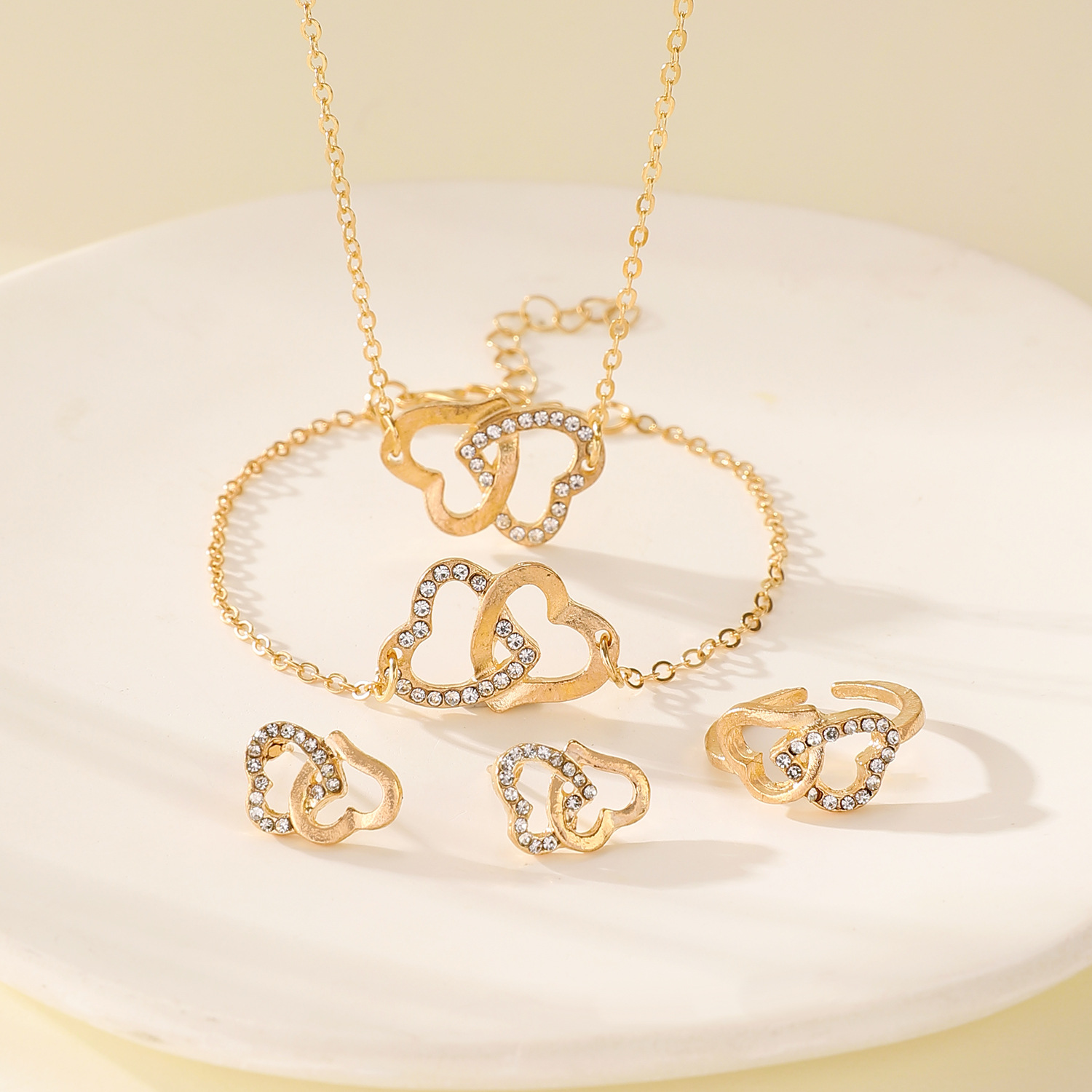 European and American diamond-encrusted double-ring heart-shaped earrings, rings, bracelets, necklaces, four-piece jewelry sets, women's fashion and high-end feel details Picture