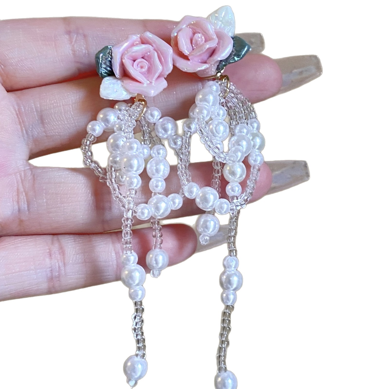 The super ethereal pink rose pearl tassel earrings exude a feminine elegance and a socialite style. The beaded ear studs are popular earrings on the Internet Item Picture