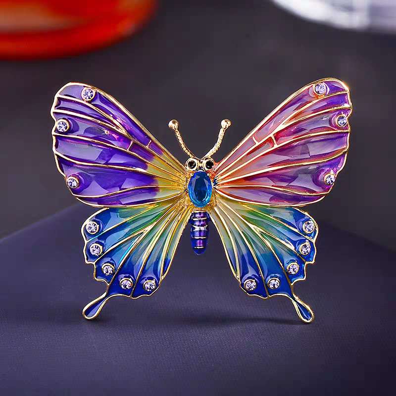 The fashionable enamel butterfly brooch features a unique and exquisite design