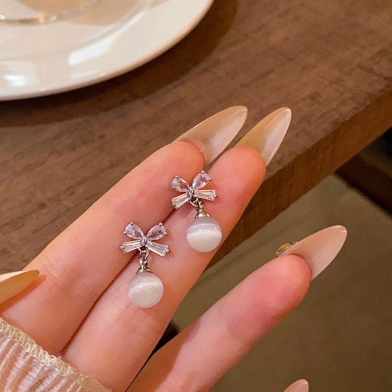 Sweet and elegant bow tassel earrings, women's fashion and high-end sense, light luxury cat's eye stone earrings, exquisite zircon earrings Specification drawing