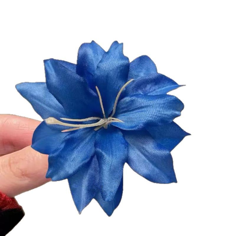 A stylish red faux lily flower fringe with an ins hairpin for taking photos, a high-end and elegant hair accessory and a versatile hair clip Item Picture