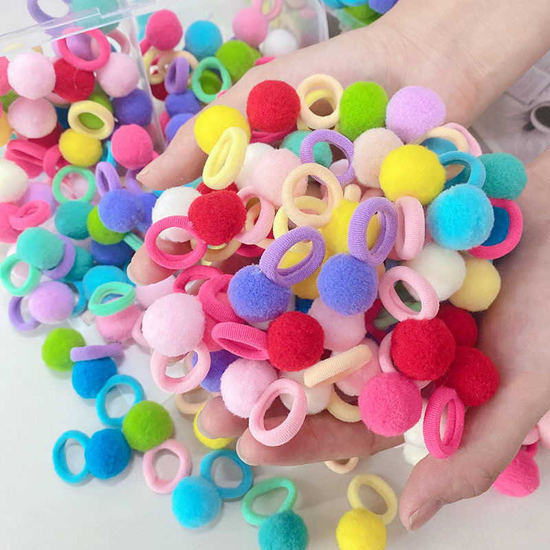 The girl's colorful pom-ball hair band is super cute. The new rubber band is a lovely hair band for kindergarten girls with high bounce and elasticity details Picture