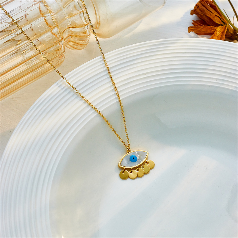 European and American unique, fashionable, creative and niche design, round tassel, oval blue eye pendant, stainless steel chain necklace details Picture