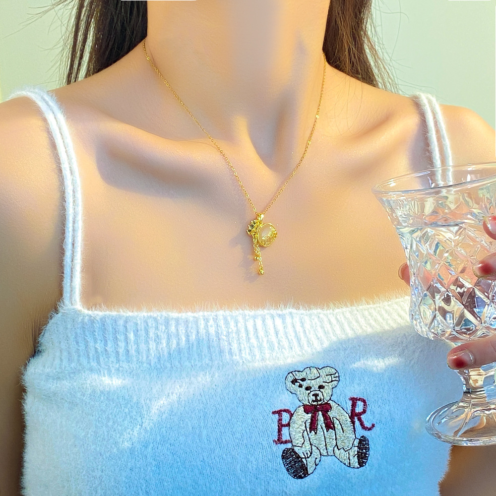 High-end cat's eye stone tassel money bag necklace, a unique design sense for women, titanium steel collarbone chain, a popular light luxury and versatile necklace details Picture