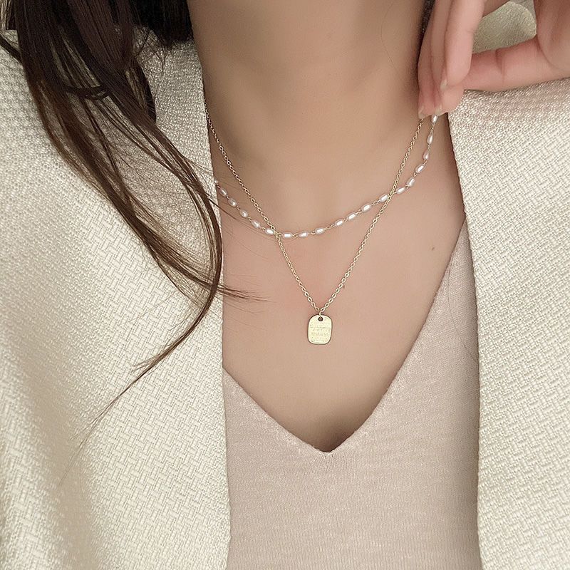 Double-layer rice-grain pearl necklace for women's niche design, light luxury hoodie chain, simple and elegant sweater chain wholesale full figure