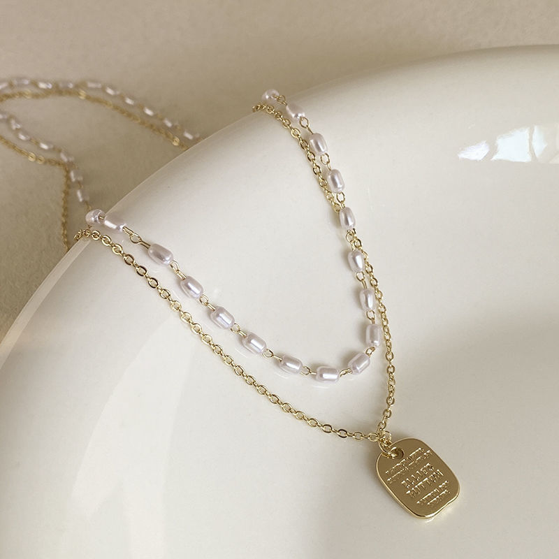 Double-layer rice-grain pearl necklace for women's niche design, light luxury hoodie chain, simple and elegant sweater chain wholesale Application Scenario