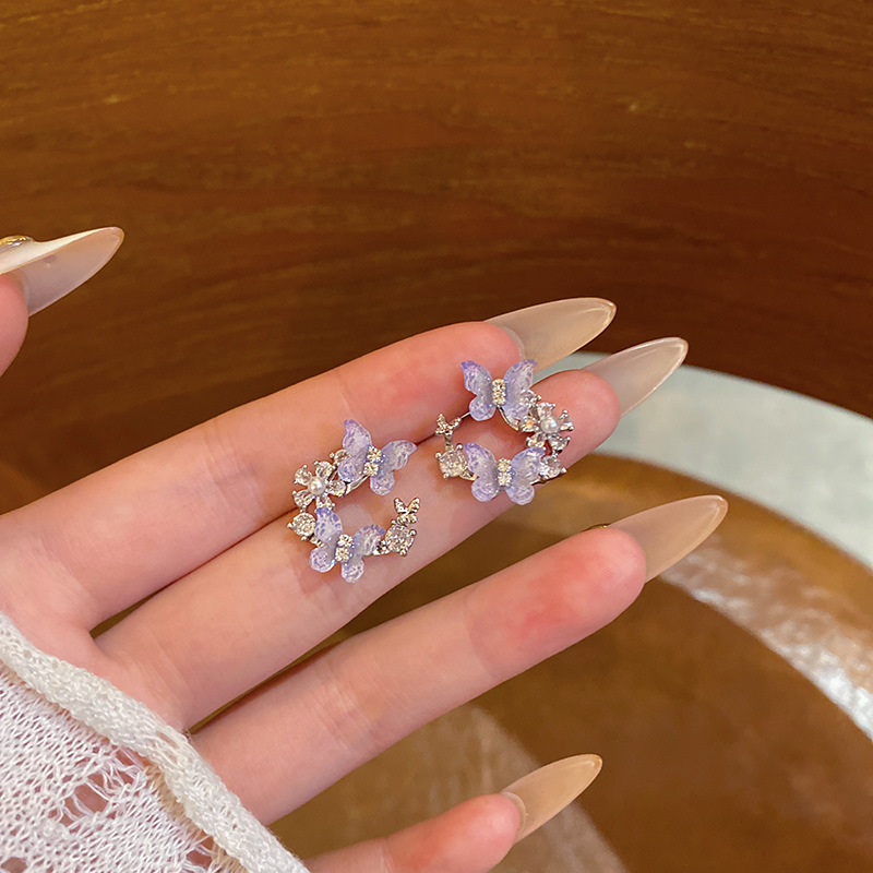 Super fairy blue diamond-encrusted butterfly earrings, cold style, niche design sense, elegant stud earrings, fashionable and versatile earrings wholesale full figure
