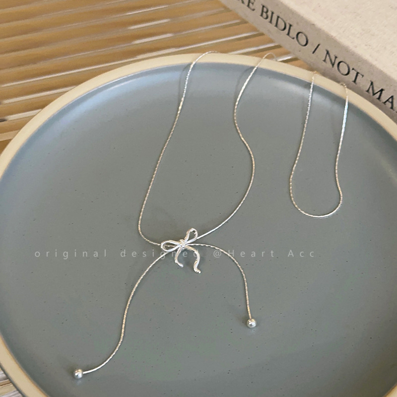 Long bow tassel pull-out necklace for women, 2024 new design sense collarbone chain, elegant neck chain, Internet celebrity accessory Application Scenario