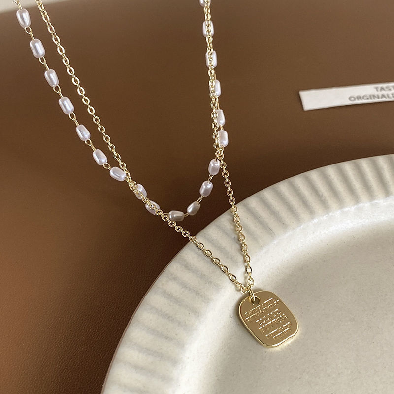 Double-layer rice-grain pearl necklace for women's niche design, light luxury hoodie chain, simple and elegant sweater chain wholesale details Picture