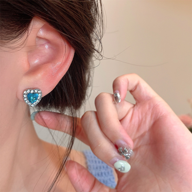Wholesale of sea blue heart-shaped zircon ear stud earrings with a cold and elegant feminine style, exquisite micro-inset moon ear stud earrings, and a versatile and personalized accessory details Picture