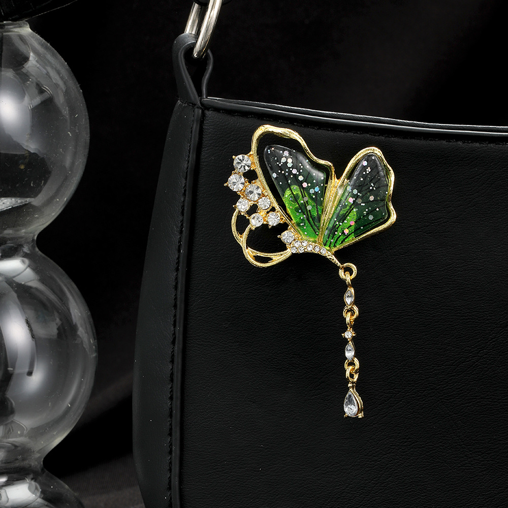 Forest-themed light luxury diamond-encrusted semi-transparent green butterfly brooch, high-end and sweet water drop fashionable and elegant brooch for women details Picture