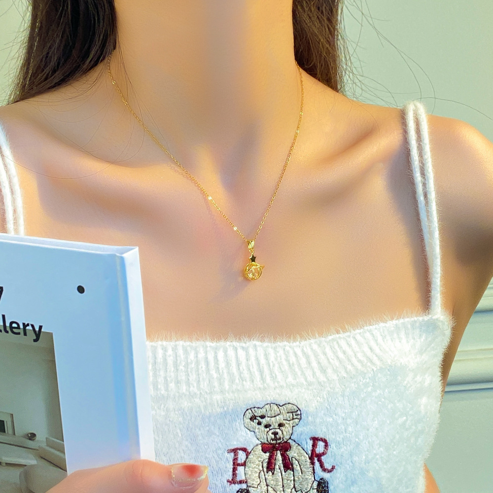 A light luxury style hollowed-out small planet pendant titanium steel necklace for women, simple and versatile fashion collarbone chain, a trendy and elegant neckchain details Picture