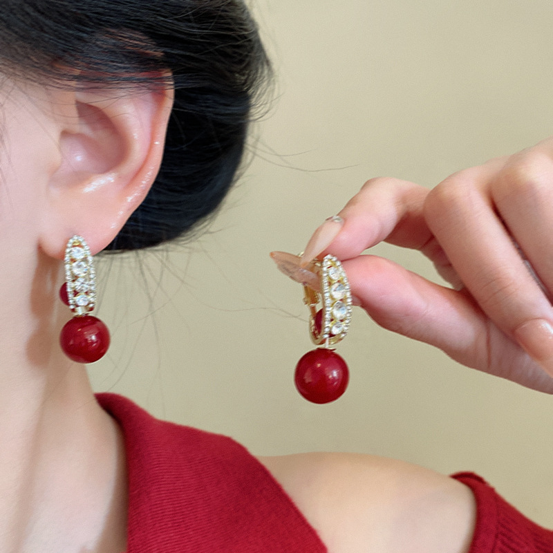Retro light luxury red pearl earrings, a woman's high-end and elegant look, super sparkling zircon stud earrings, New Year's festive earrings wholesale details Picture