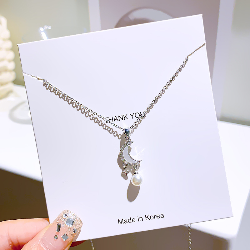 Silver niche design sense moon and star hanging pearl pendant titanium steel necklace, simple and elegant, light luxury collarbone chain for women Application Scenario