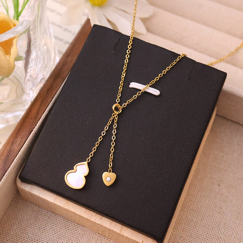 A non-fading 18k gold powder-coated shell tassel gourd titanium steel necklace with a unique feminine charm and a high-end collarbone chain accessory Application Scenario