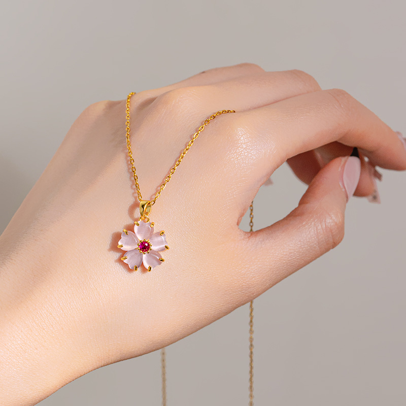 Wholesale of simple pink cherry blossom pendant titanium steel necklace with a unique design sense for women, cat's eye stone flower collarbone chain Application Scenario