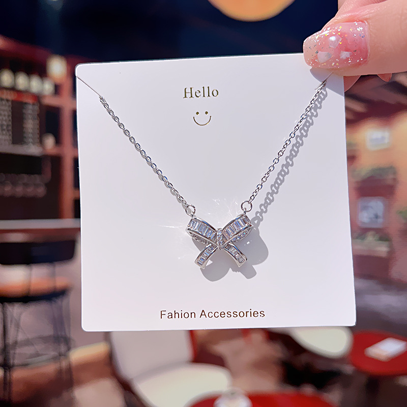 A silver bow titanium steel necklace with a Japanese and Korean design sense, a delicate zircon light luxury collarbone chain for women, and a versatile accessory for Internet celebrities full figure